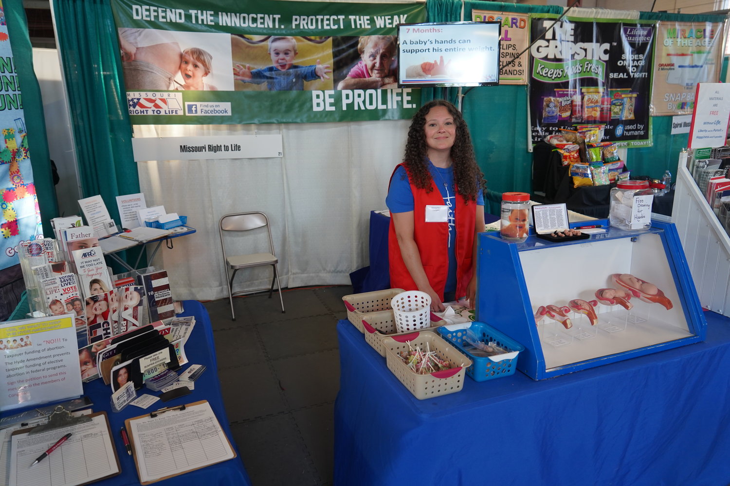 Veronica Cumpton greets visitors to the Right to Life booth at the 2022 Missouri State Fair in Sedalia.